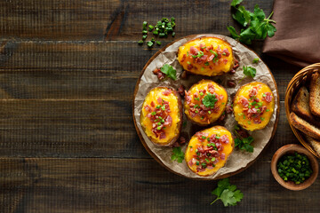 Baked stuffed potatoes with bacon, green onion and cheddar cheese