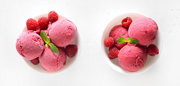 Raspberry ice cream scoop with fresh berries