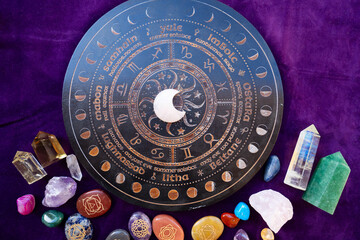 Gemstones minerals stones and obelisks over astrology desk. Witchcraft, herbal medicine and...