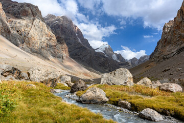 Fototapeta na wymiar A stormy river in the mountains of Tajikistan.
