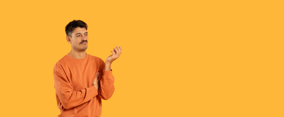 Man in orange sweatshirt against orange background