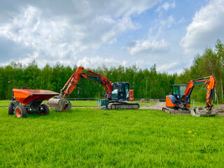 Mini crawler excavator for laying utilities on construction sites
