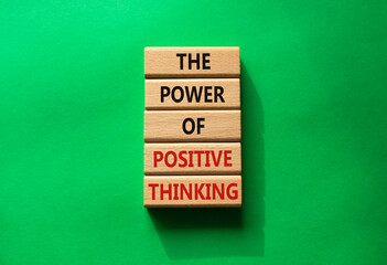 Positive Thinking symbol. Wooden blocks with words The Power of Positive Thinking. Beautiful green background. Positive Thinking concept. Copy space.