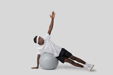 Side plank exercise on a fitness ball