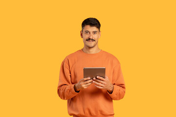 Man holding a tablet with a smile