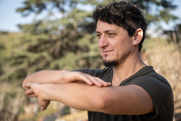 Close-up of a happy man practicing Kung Fu outdoors.