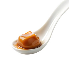 Caramel on white spoon isolated on transparent background