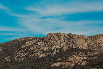 Fototapeta na wymiar Rugged Mountain Peak Under a Clear Blue Sky