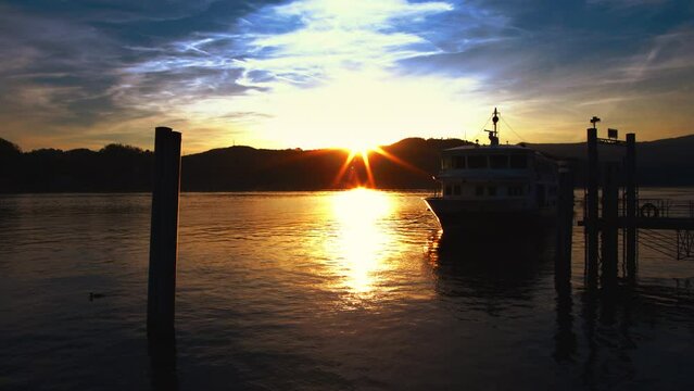 Boat at sunset in the port of Angera