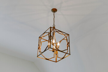 Geometric Brass Ceiling Light Fixture in A Minimalist Room