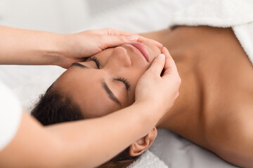 Obraz na płótnie Canvas Spa face massage. Woman getting spa treatment