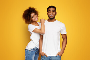 Cute lovely african-american man and woman cuddling