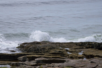 Ocean waves meeting a rocky shore