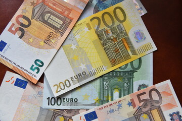 some current euro bills - 784769655