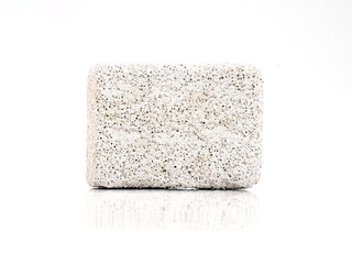 Natural pumice stone for feet, hard exfoliating dead skin remover for feet. Isolated on white background.  - obrazy, fototapety, plakaty