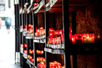 Offering candles in a Catholic church - 784770466