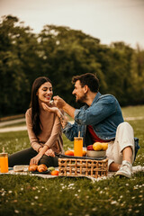 Couple sharing a special picnic moment amidst scenic beauty