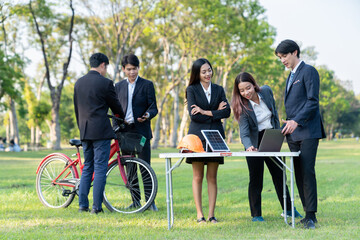 Group of asian business people with strong teamwork establish outdoor eco business office at...