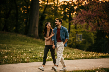 Blissful couple taking in the beauty of the sunset on a romantic walk