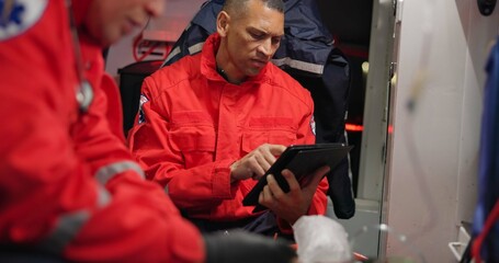 Talking, man and a tablet at sea for rescue emergency, communication and training at sea. Teamwork,...