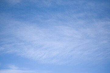 Fototapeta premium Blue sky background with white short frequency clouds