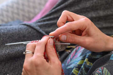 woman's hands knit a sock with knitting needles. close-up 3