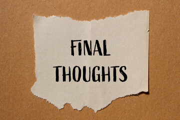 Final thoughts words written on ripped paper with brown background. Conceptual symbol. Copy space.
