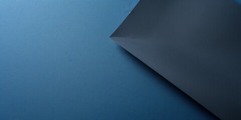 Blue background with dark blue paper on the right side, minimalistic background, copy space concept, top view, flat lay, high resolution photography, stock photo, professional color grading - obrazy, fototapety, plakaty