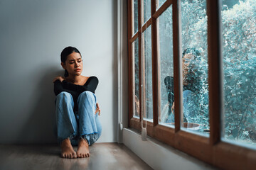 Depressed young Asian woman with mental health problem in mind need uttermost treatment from overthinking fatigue, disruptive thought, dissocial, anxiety and other mental health disorders . - obrazy, fototapety, plakaty
