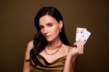 Photo of cunning lady bluff holding poker cards full house winner victory in casino over brown color background