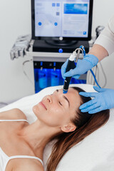 Middle aged woman receiving hydro facial lifting procedure. Natural, mature woman face with healthy...