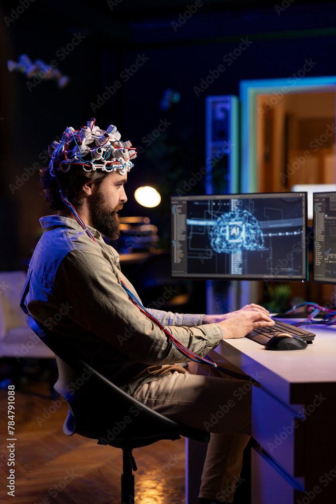 Poster computer engineer with eeg headset on writing code allowing him to transfer mind into virtual world,