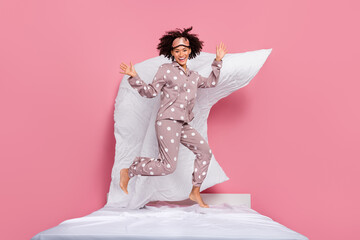 Photo of sweet excited lady wear pajama jumping high having fun isolated pink color background
