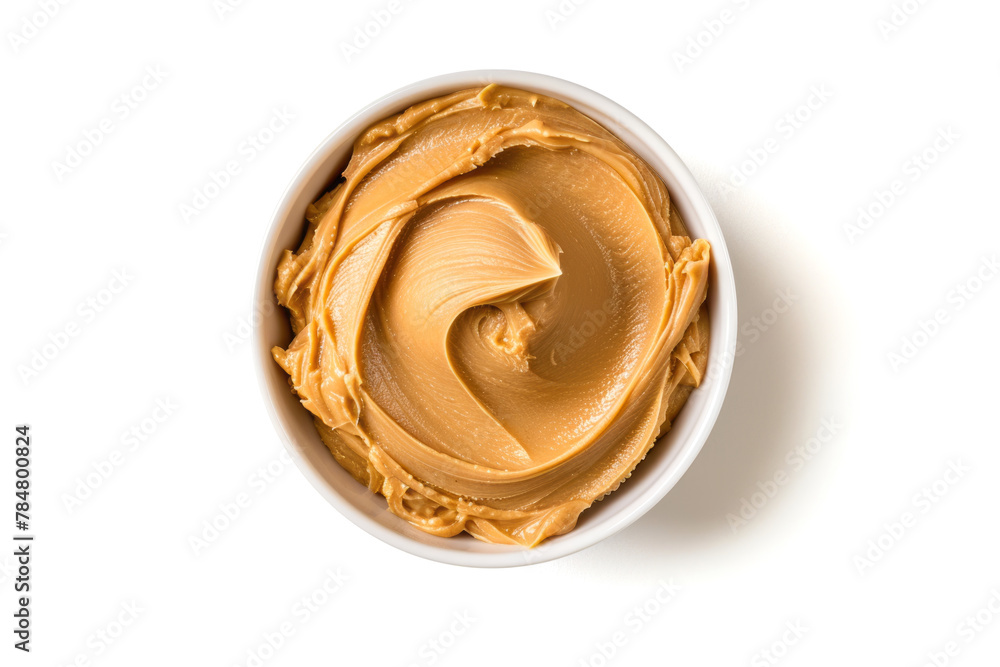 Wall mural bowl of creamy peanut butter isolated on white background close up, top view