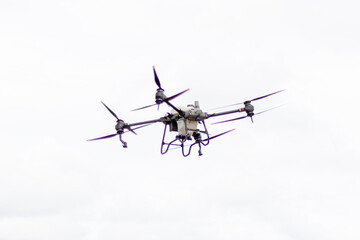 Unmanned aerial vehicle (UAV), commonly known as a drone, for agricultural fertilizer and pesticide spraying