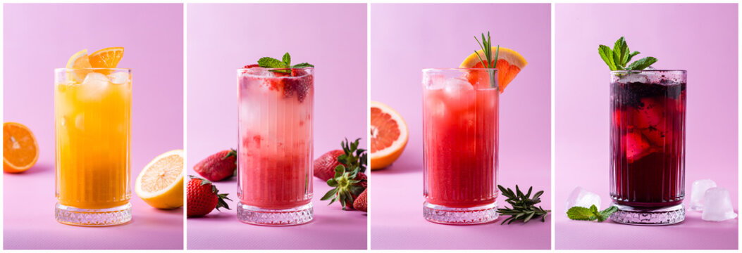 set of summer cold cocktails with orange, strawberry, grapefruit and berries on a pink background, natural lemonades with fruits and soda