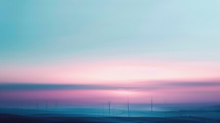 The hazy horizon of blues pinks and purples serves as the backdrop for the darkened forms of wind turbines their blades blending seamlessly into the blurred landscape. . - obrazy, fototapety, plakaty