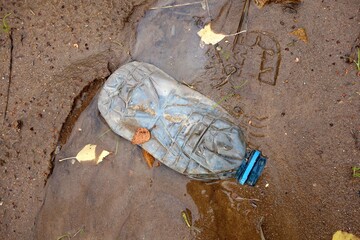 Non-degradable plastic bottle litter the ground