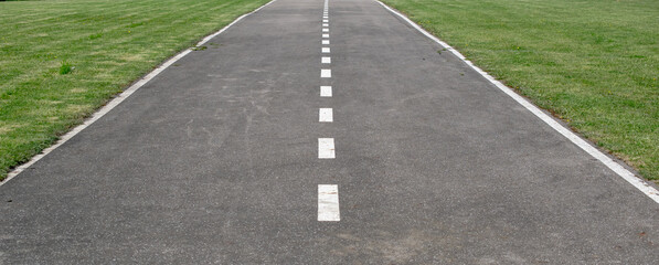 empty airport runway, asphalt with white lines