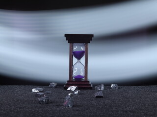 An Hourglass with Vibrant Purple Sand Measuring Time Elegantly