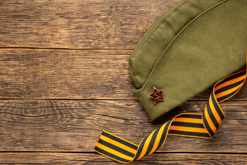 Cap with a star and George ribbon. The concept of the Great Victory Day.