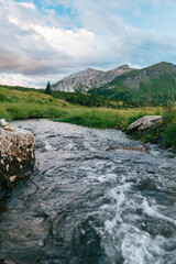 Mountain river.Water flow and beautiful mountain view. Beautiful mountain landscape. - 784829053