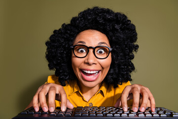 Portrait of pretty lady write keyboard wear yellow shirt isolated on khaki color background