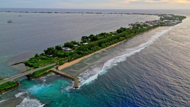 MARSHALL ISLANDS - 3.18.2024 - Excellent aerial footage of waves lapping an atoll in the Marshall Islands.