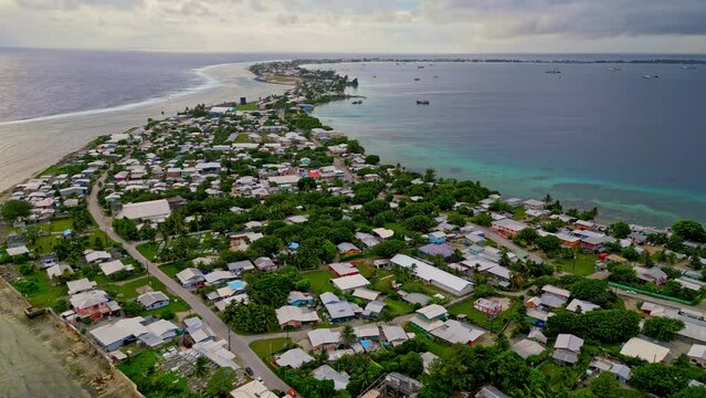 MARSHALL ISLANDS - 3.18.2024 - Excellent aerial panning view of houses on the coast of Majuro in the Marshall Islands.
