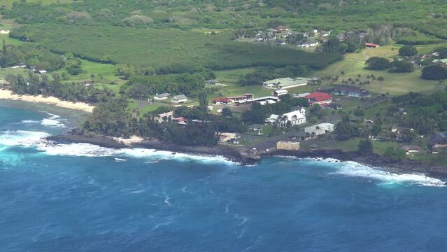MOLOKAI - 3.19.2024 - Very good aerial footage zooming out from the leper colony on the coast of Molokai, Hawaii.