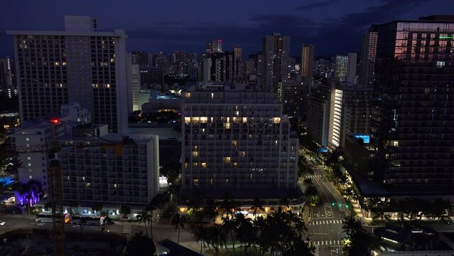 WAIKIKI - 3.19.2024 - Great aerial view of cars driving down a busy street in Waikiki, Hawaii.