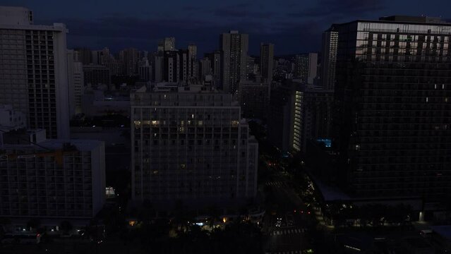 WAIKIKI - 3.19.2024 - Very good aerial time-lapse footage of night-to-day traffic in Waikiki, Hawaii.