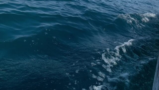 Close up view of sea waves from the boat.