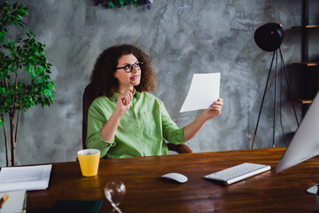 Photo of dreamy nice successful woman solving question sitting in chair modern office interior...